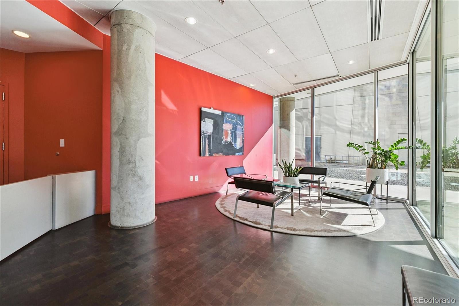 1200 Acoma Street, Unit 303 Denver, CO 80204 - Photo 35 of 48 a living room with fireplace furniture and floor to ceiling window