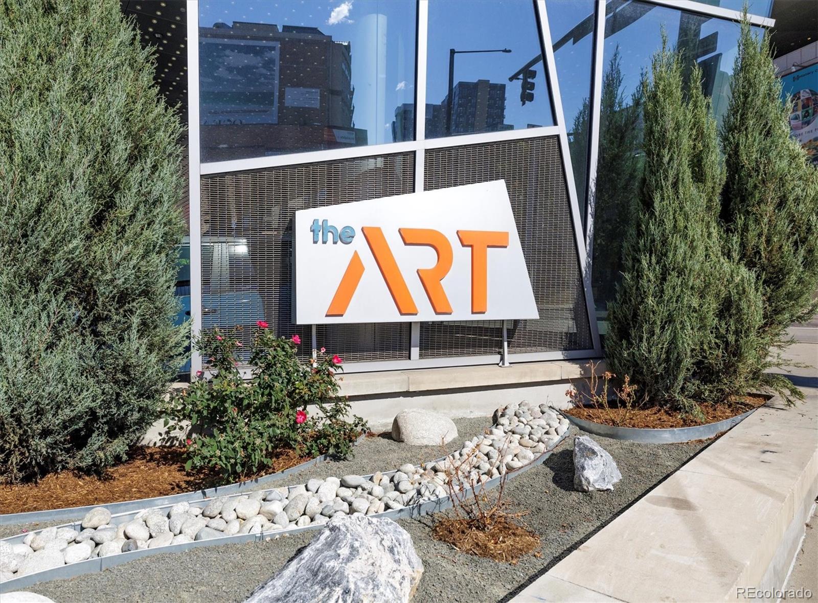 1200 Acoma Street, Unit 303 Denver, CO 80204 - Photo 39 of 48 a wooden bench sitting in front of a building