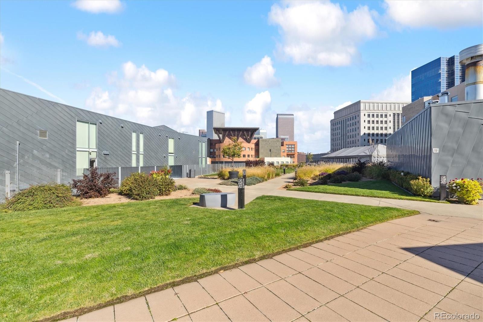 1200 Acoma Street, Unit 303 Denver, CO 80204 - Photo 7 of 48 a view of a city with tall buildings and a big yard