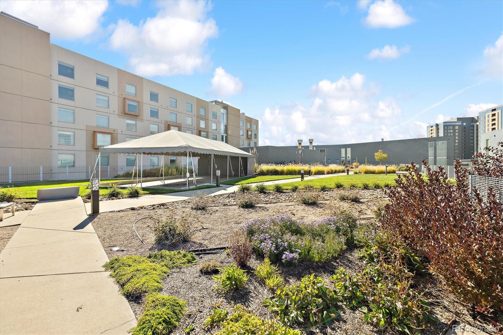 1200 Acoma Street, Unit 303 Denver, CO 80204 - Photo 8 of 48 a view of a swimming pool with a lounge chairs
