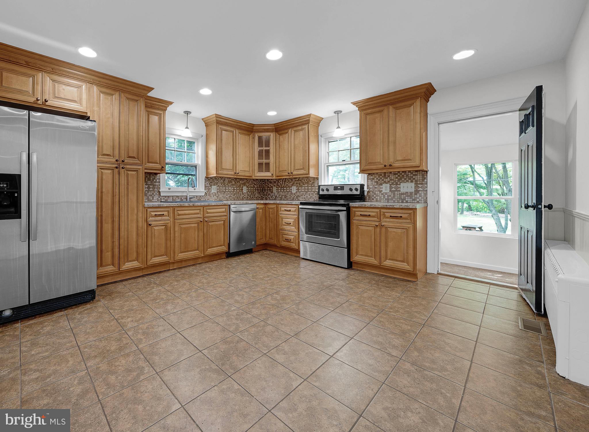 2031 Oak Road Hatfield, PA 19440 - Photo 14 of 59 a kitchen with stainless steel appliances granite countertop a refrigerator oven a sink and dishwasher