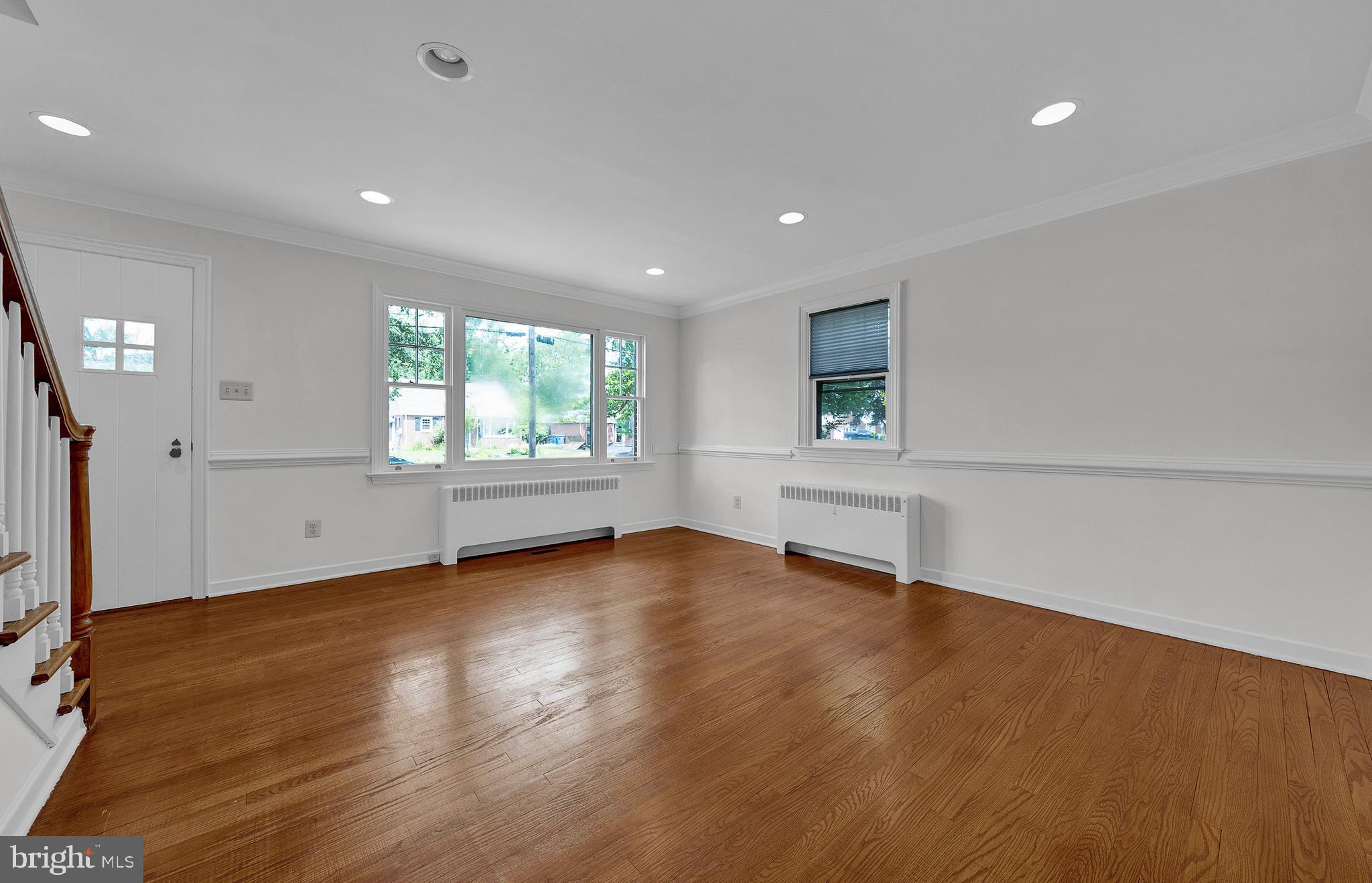 2031 Oak Road Hatfield, PA 19440 - Photo 7 of 59 an empty room with wooden floor and windows