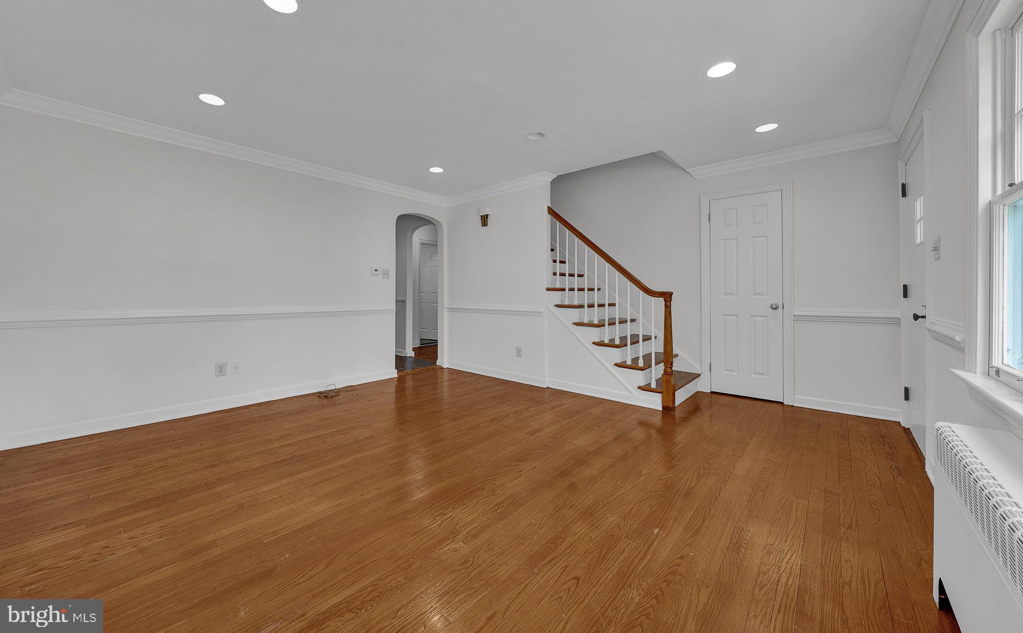 2031 Oak Road Hatfield, PA 19440 - Photo 10 of 59 a view of an empty room with wooden floor and stairs