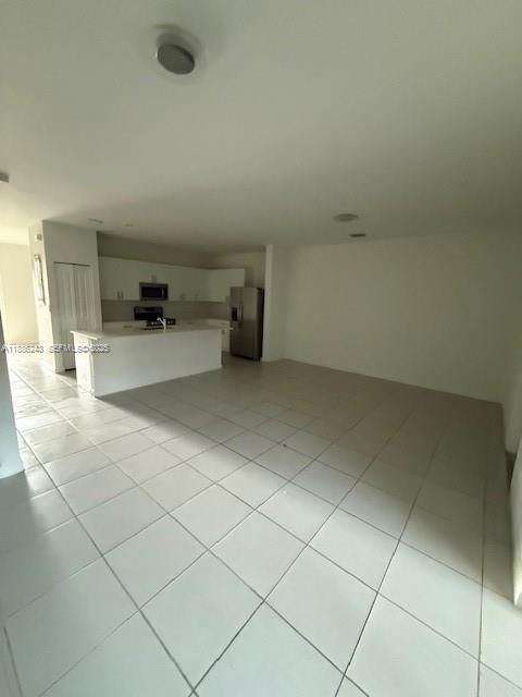 26413 Southwest 149th Avenue, Unit 26413 Homestead, FL 33032 - Photo 18 of 29 a room with a wooden cabinets and utility room