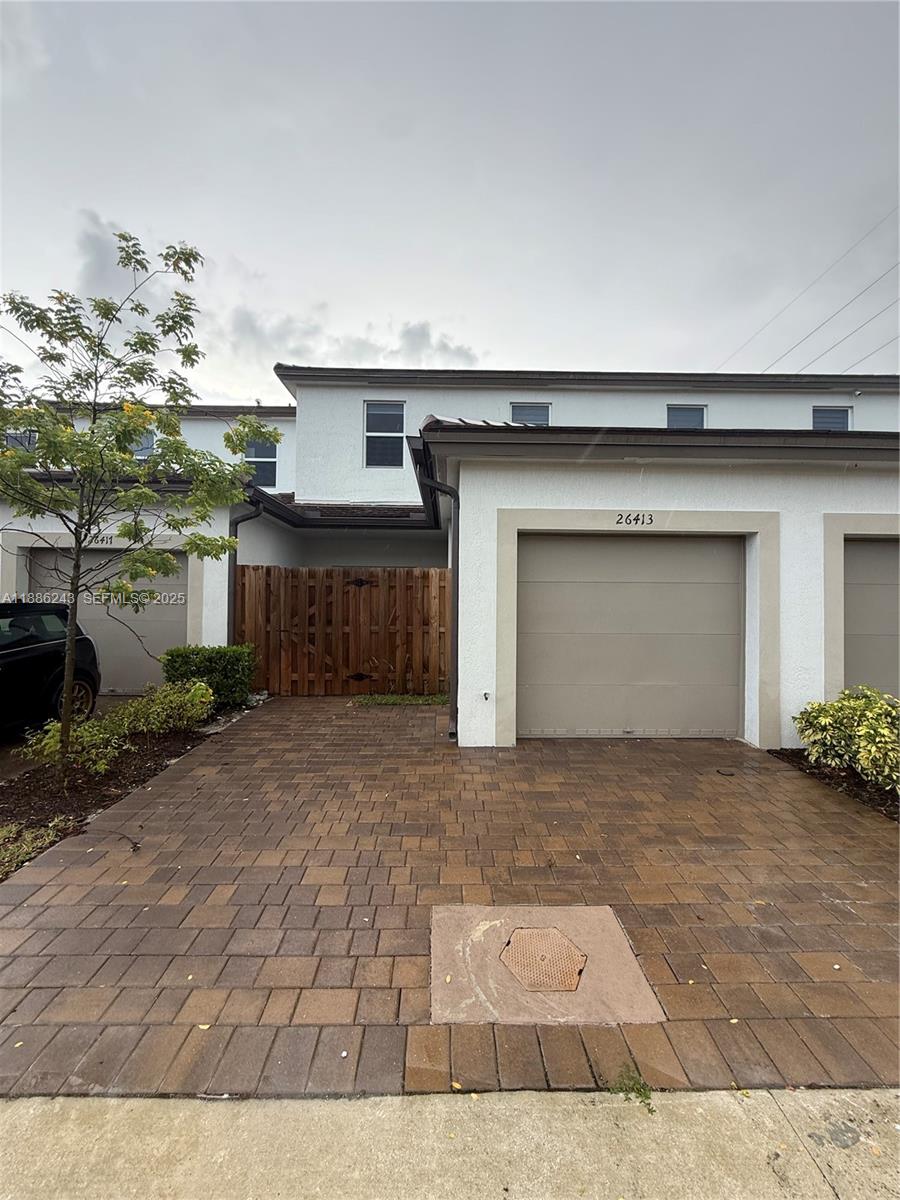 26413 Southwest 149th Avenue, Unit 26413 Homestead, FL 33032 - Photo 23 of 29 a view of a house with a garage