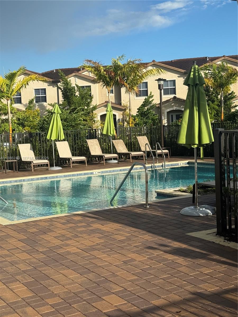 26413 Southwest 149th Avenue, Unit 26413 Homestead, FL 33032 - Photo 26 of 29 swimming pool view with a lake view