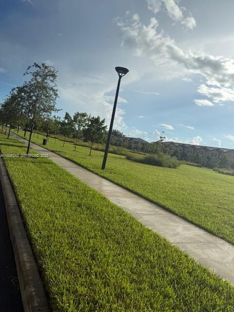 26413 Southwest 149th Avenue, Unit 26413 Homestead, FL 33032 - Photo 28 of 29 a view of a golf course with a lake