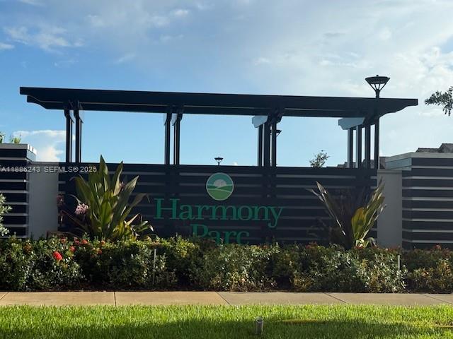 26413 Southwest 149th Avenue, Unit 26413 Homestead, FL 33032 - Photo 4 of 29 a front view of a house with garden