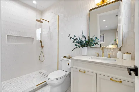 a view of a patio with table and chairs with wooden floor and stairs