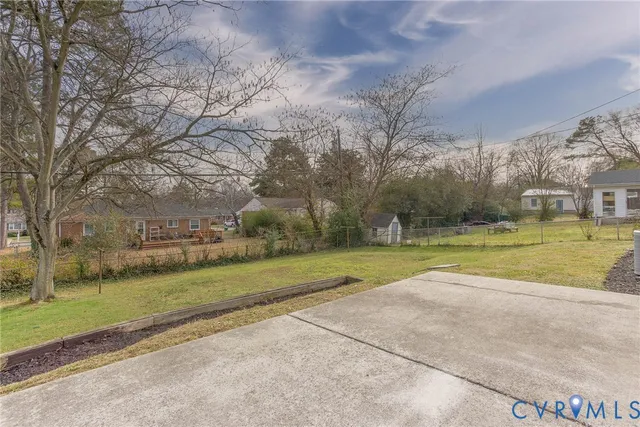 a view of a park with large trees