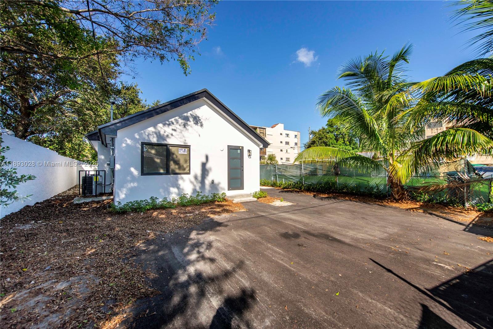 764 Northwest 36th Avenue, Unit 1 Miami, FL 33125 - Photo 17 of 17 a view of a house with a patio