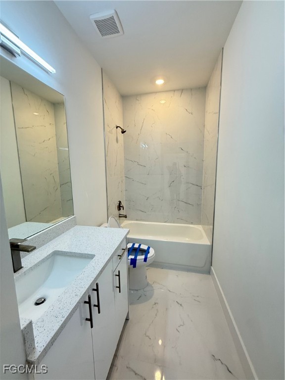 4719 28th Street Southwest Lehigh Acres, FL 33973 - Photo 10 of 13 a bathroom with a tub sink and mirror