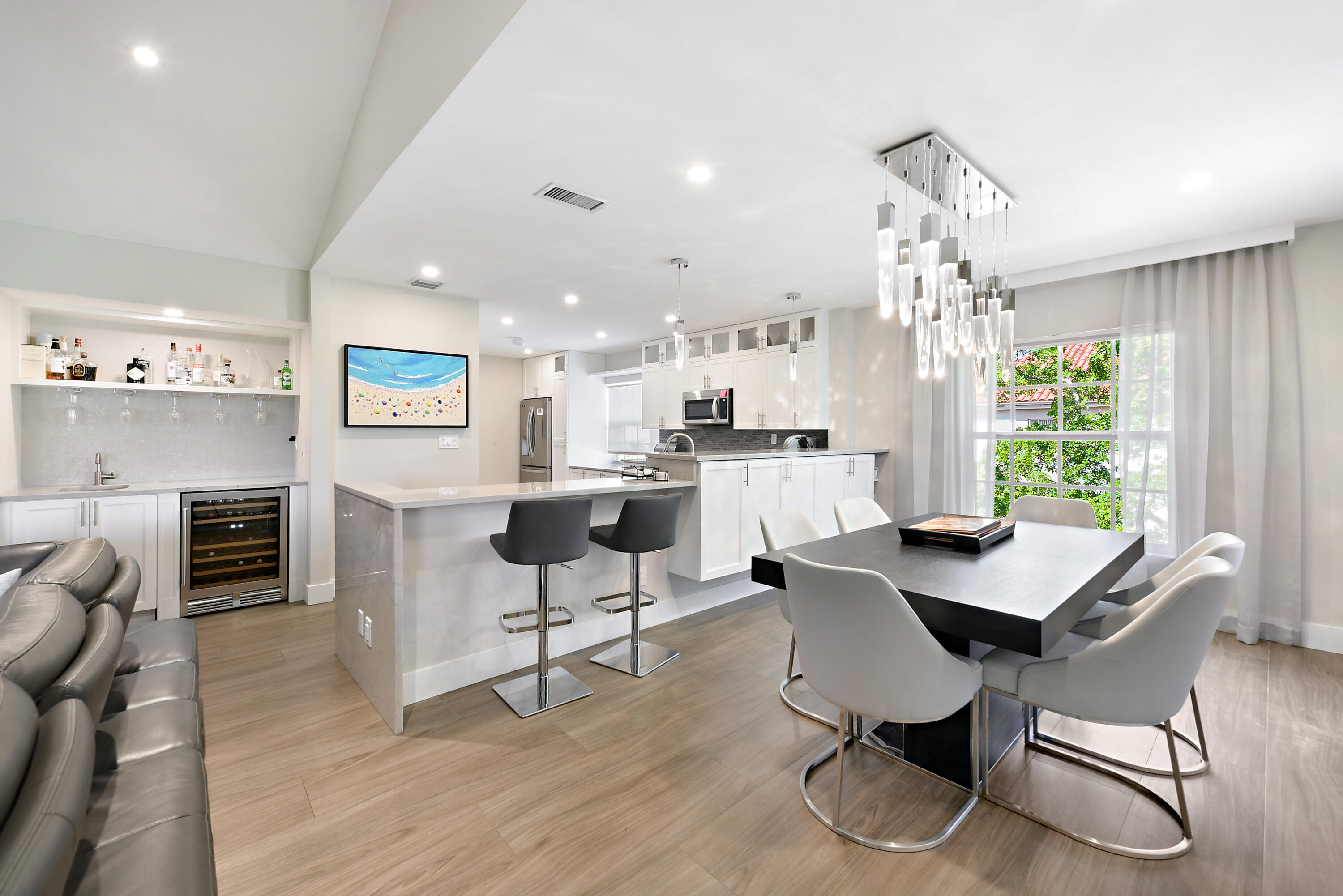 7369 Orangewood Lane, Unit 301 Boca Raton, FL 33433 - Photo 14 of 53 a view of a dining room with furniture window and wooden floor