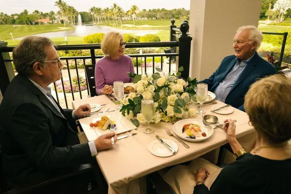 a view of a dining room with furniture window and outdoor view