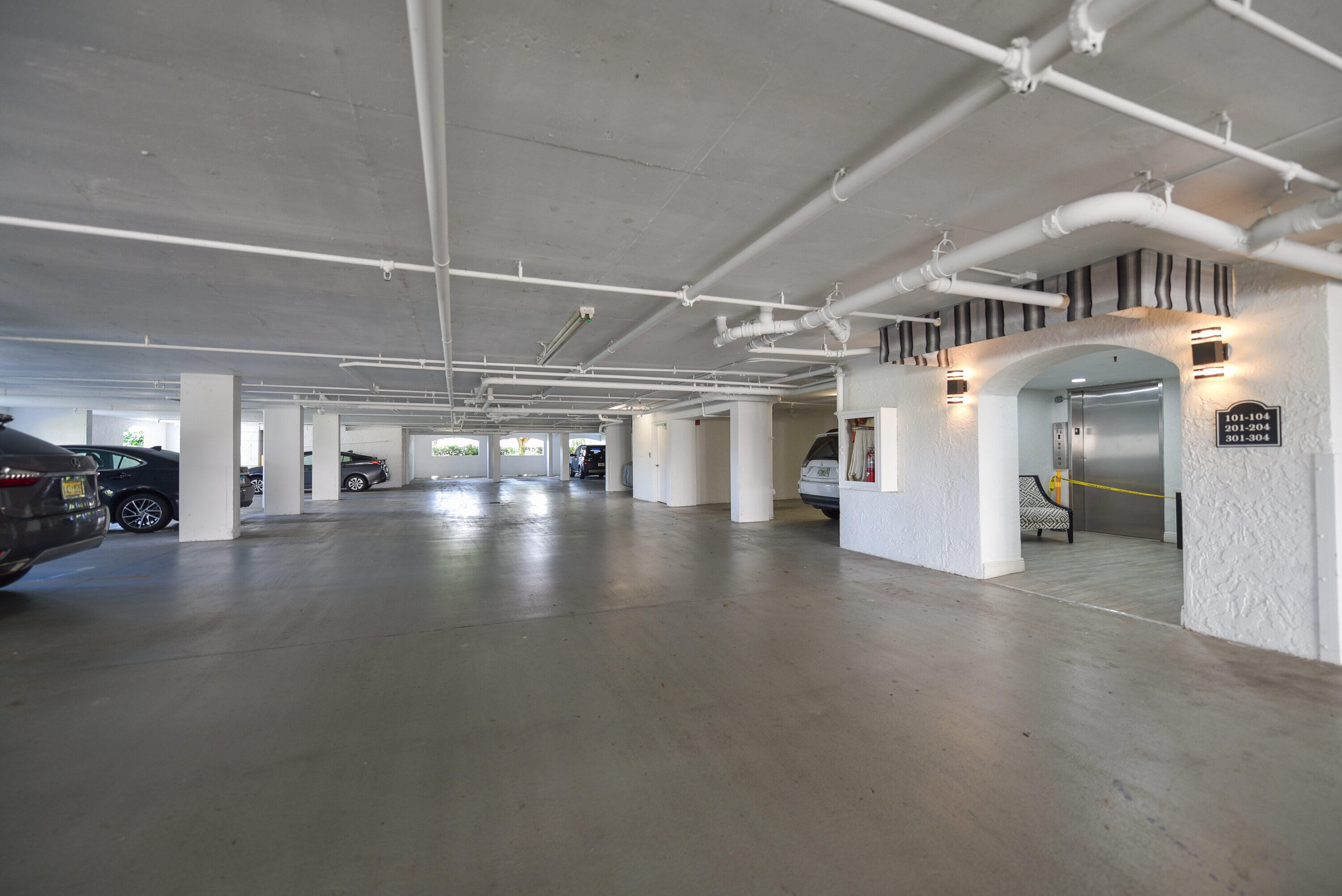 7369 Orangewood Lane, Unit 301 Boca Raton, FL 33433 - Photo 5 of 53 a view of a building with lots of traffic signal lights