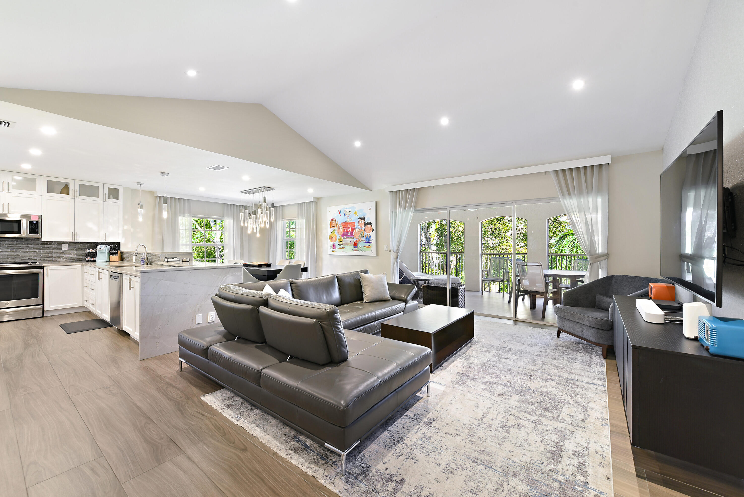 7369 Orangewood Lane, Unit 301 Boca Raton, FL 33433 - Photo 7 of 53 a living room with fireplace furniture and a large window