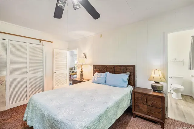 a bedroom with a bed and a cabinets