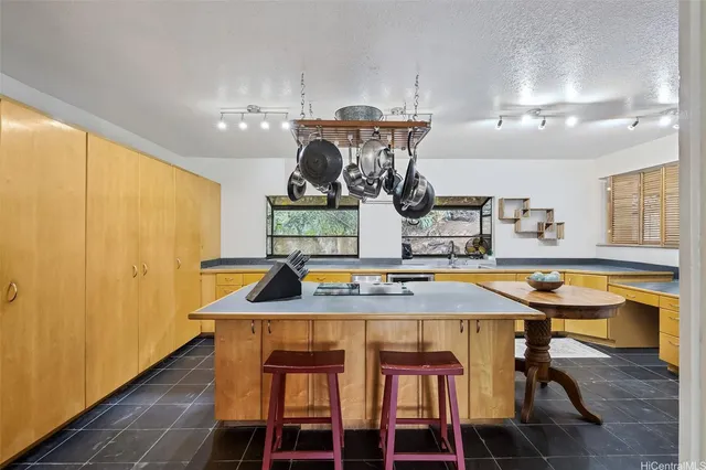 a kitchen with a table and chairs in it