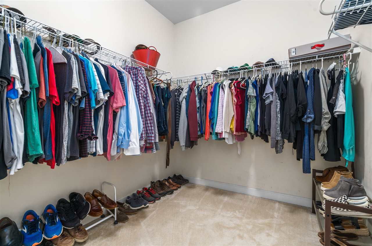 1520 Wood Spring Court Raleigh, NC 27614 - Photo 20 of 30 This is one of two walk-in closets in the first floor master bedroom with lots of wiring shelving. Walk-in-closet