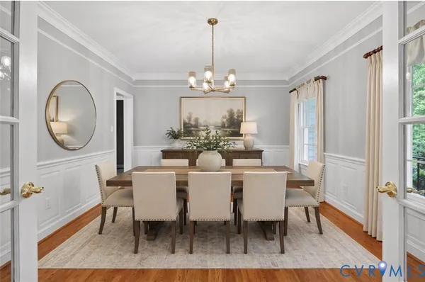 a kitchen with stainless steel appliances granite countertop a refrigerator a stove and a sink