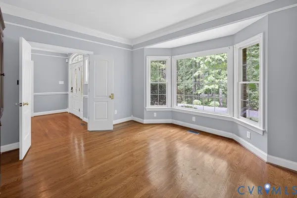 a view of a room with lots of wooden furniture