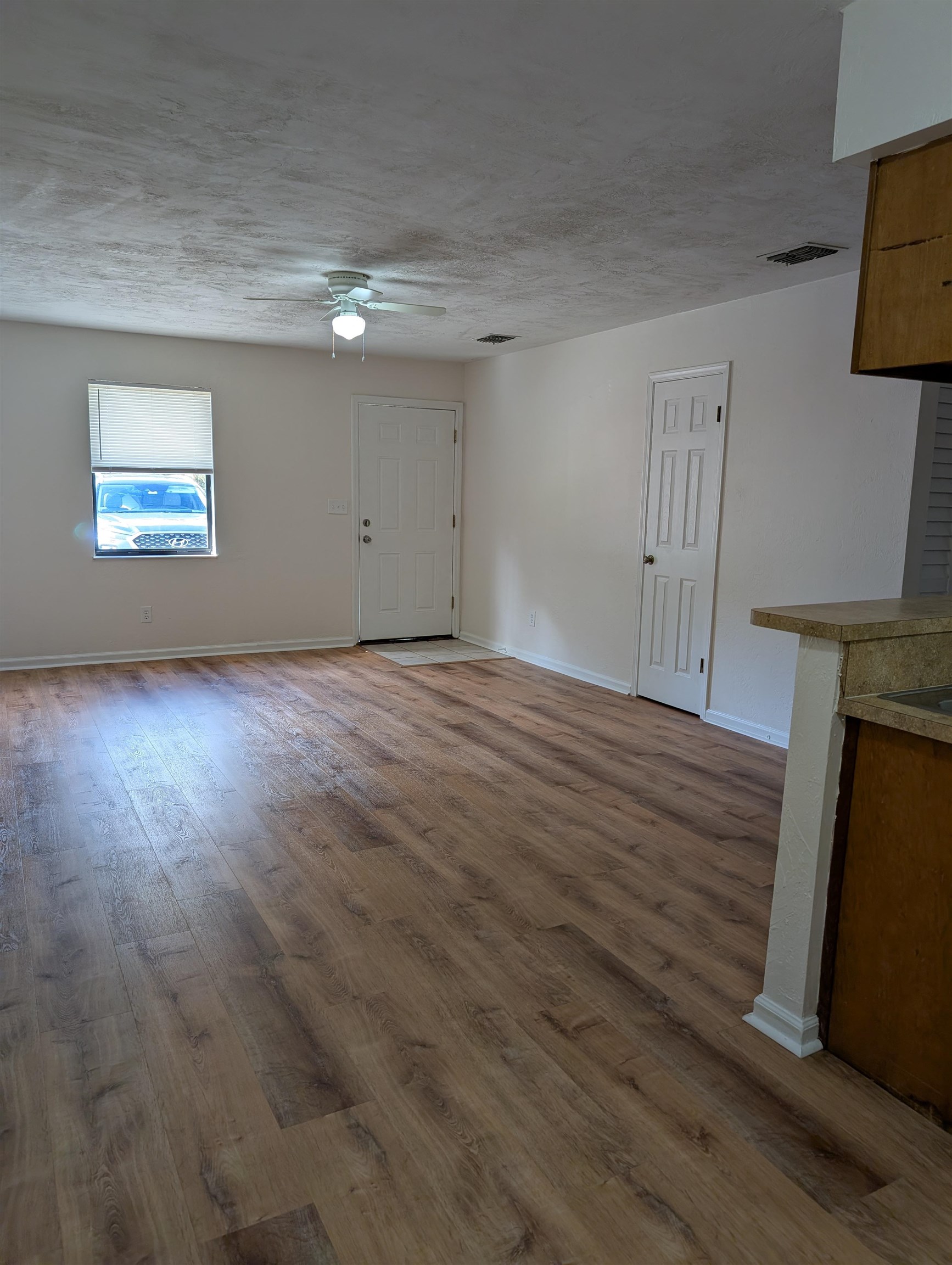 3891 Osprey Circle, Unit B St. Augustine, FL 32086 - Photo 5 of 18 a view of empty room with wooden floor