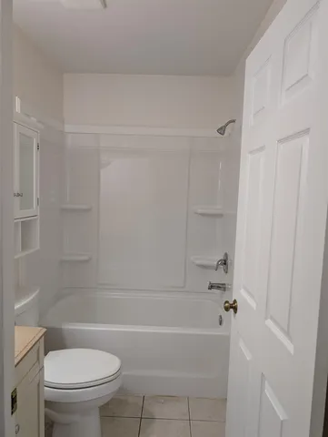 a bathroom with a toilet and a bathtub