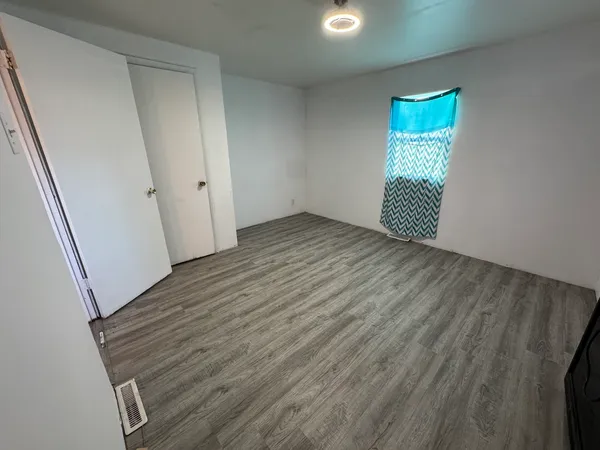 a view of an empty room with a window