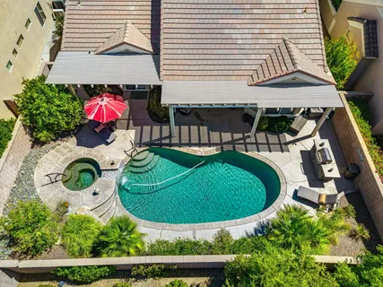 an aerial view of a house roof deck and chairs
