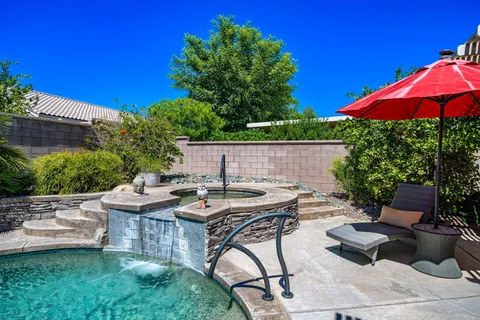 a view of a backyard with sitting area