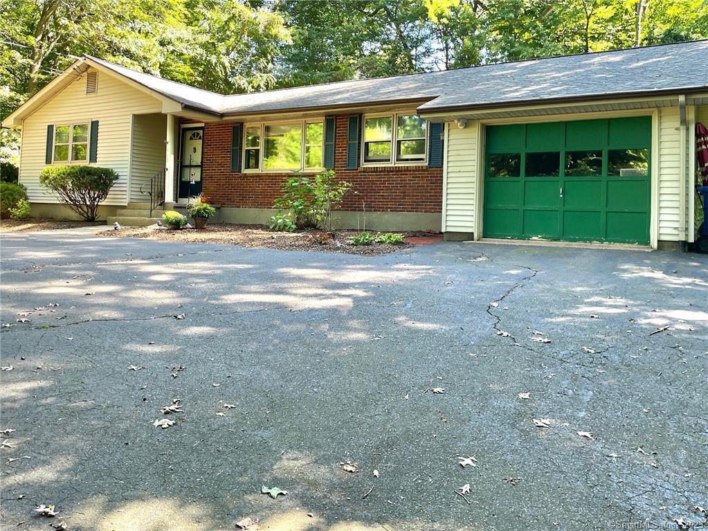 868 Neipsic Road Glastonbury, CT 06033 - Photo 1 of 1 a front view of a house with a yard and garage