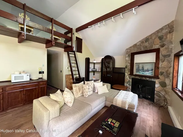 a view of a kitchen with a sink and a refrigerator