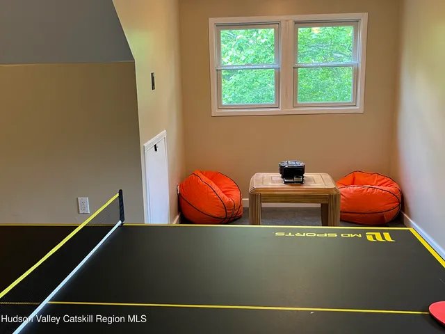 a view of a lake with lawn chairs