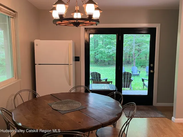 a view of a house with roof deck and garden