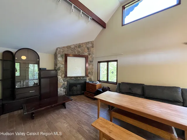 a bathroom with a shower curtain and sink