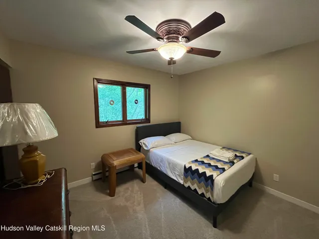 a picture of an empty room with wooden floor