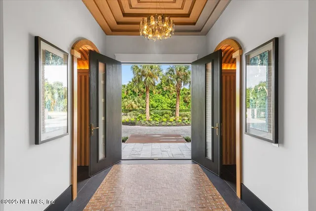 a kitchen with a sink a stove a dining table and chairs