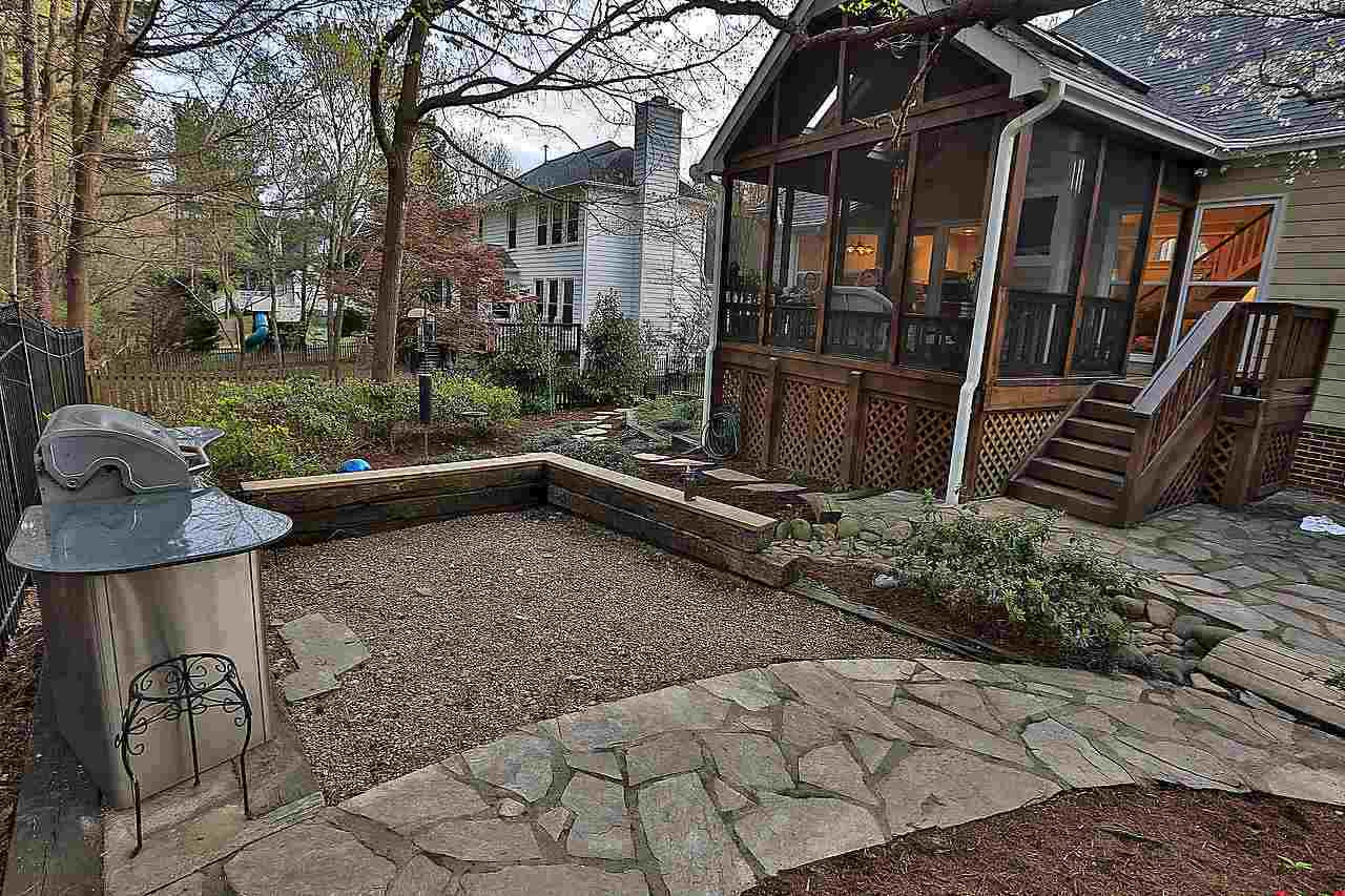 8536 Yucca Trail Raleigh, NC 27615 - Photo 16 of 23 Picturesque back yard! The gas grill with granite work surface conveys with the home! back yard