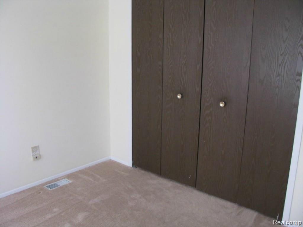 57269 Beaconsfield Road, Unit 34 Washington, MI 48094 - Photo 11 of 18 10. Closet in Bedroom 1