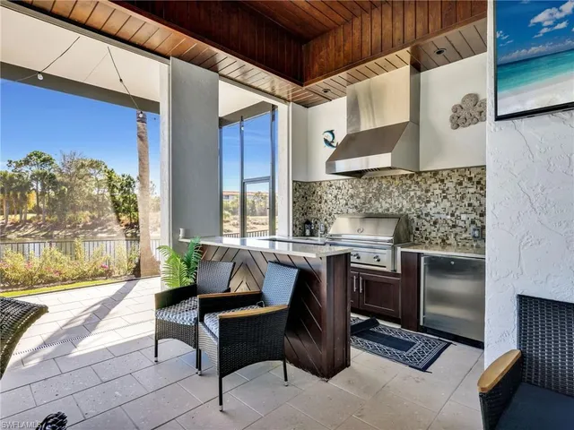 a dining room with furniture and a floor to ceiling window