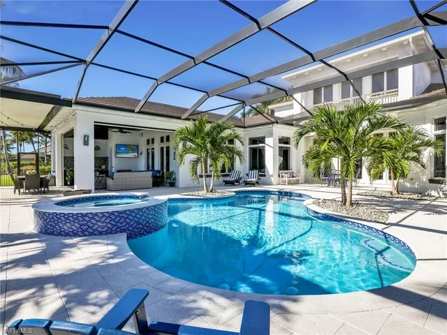 a view of a patio with swimming pool table and chairs