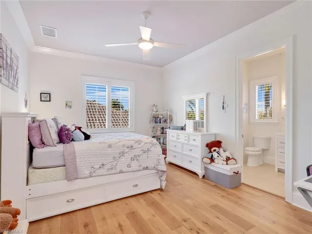 a spacious bedroom with a bed and a window