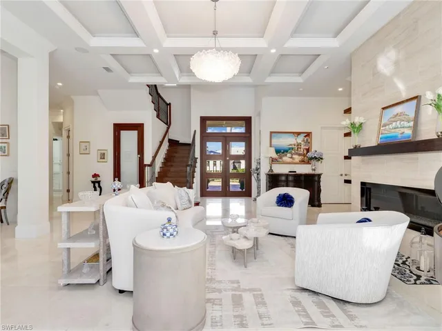 a living room with fireplace furniture and decor