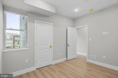 a kitchen with stainless steel appliances a refrigerator sink and cabinets
