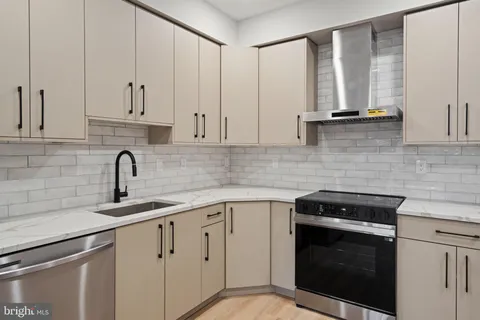 a view of kitchen and refrigerator