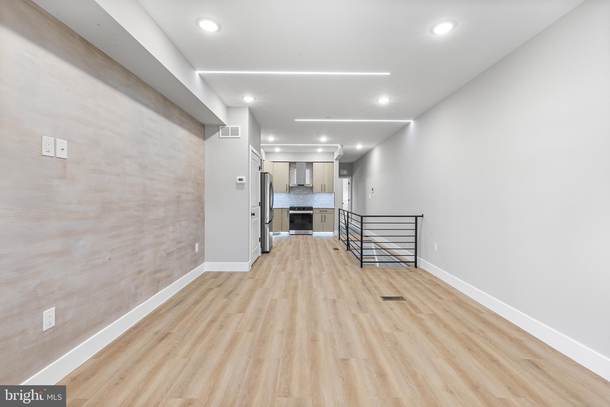 1413 North 8th Street Philadelphia, PA 19122 - Photo 23 of 44 a view of empty room with wooden floor and fireplace