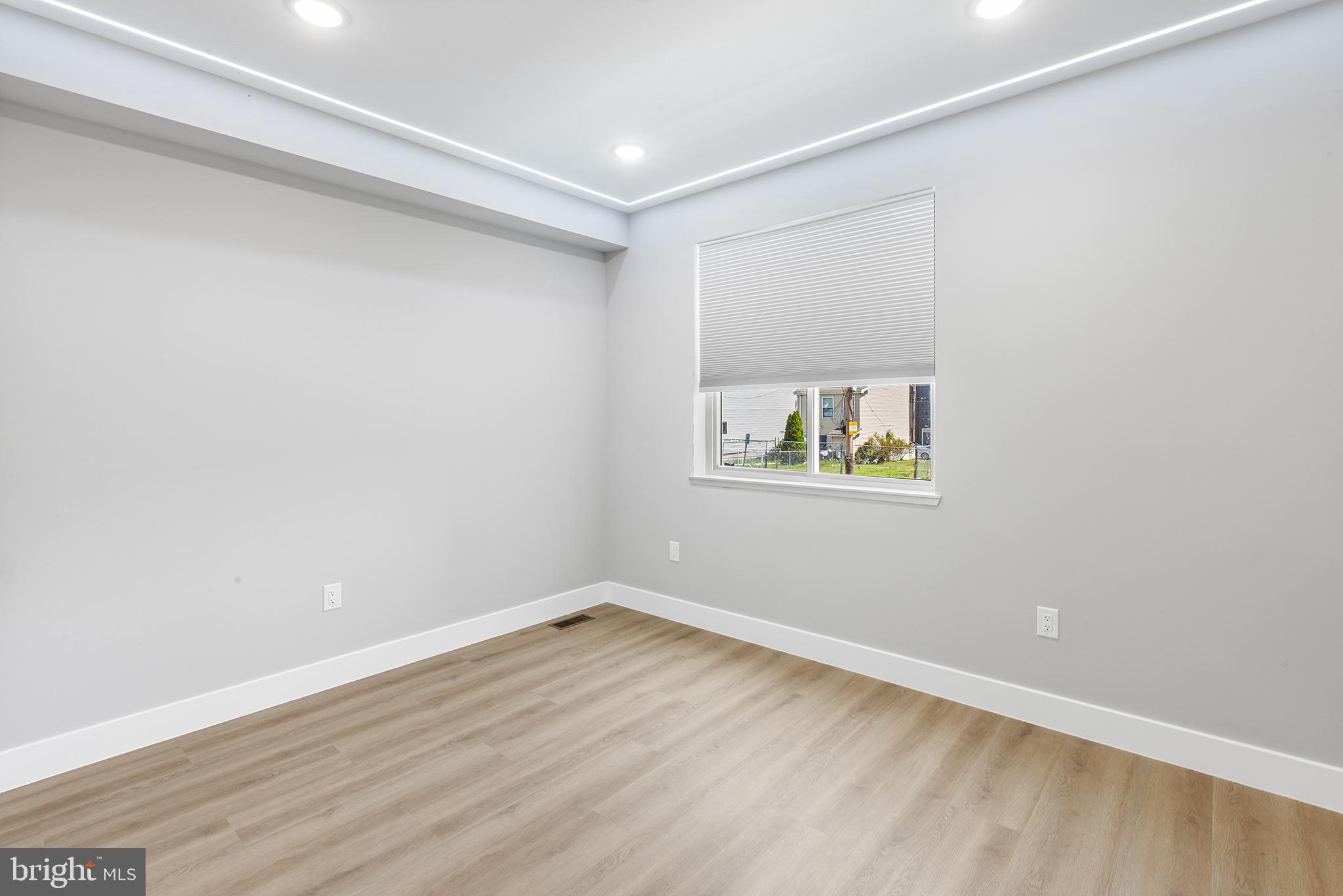1413 North 8th Street Philadelphia, PA 19122 - Photo 29 of 44 a view of an empty room with wooden floor