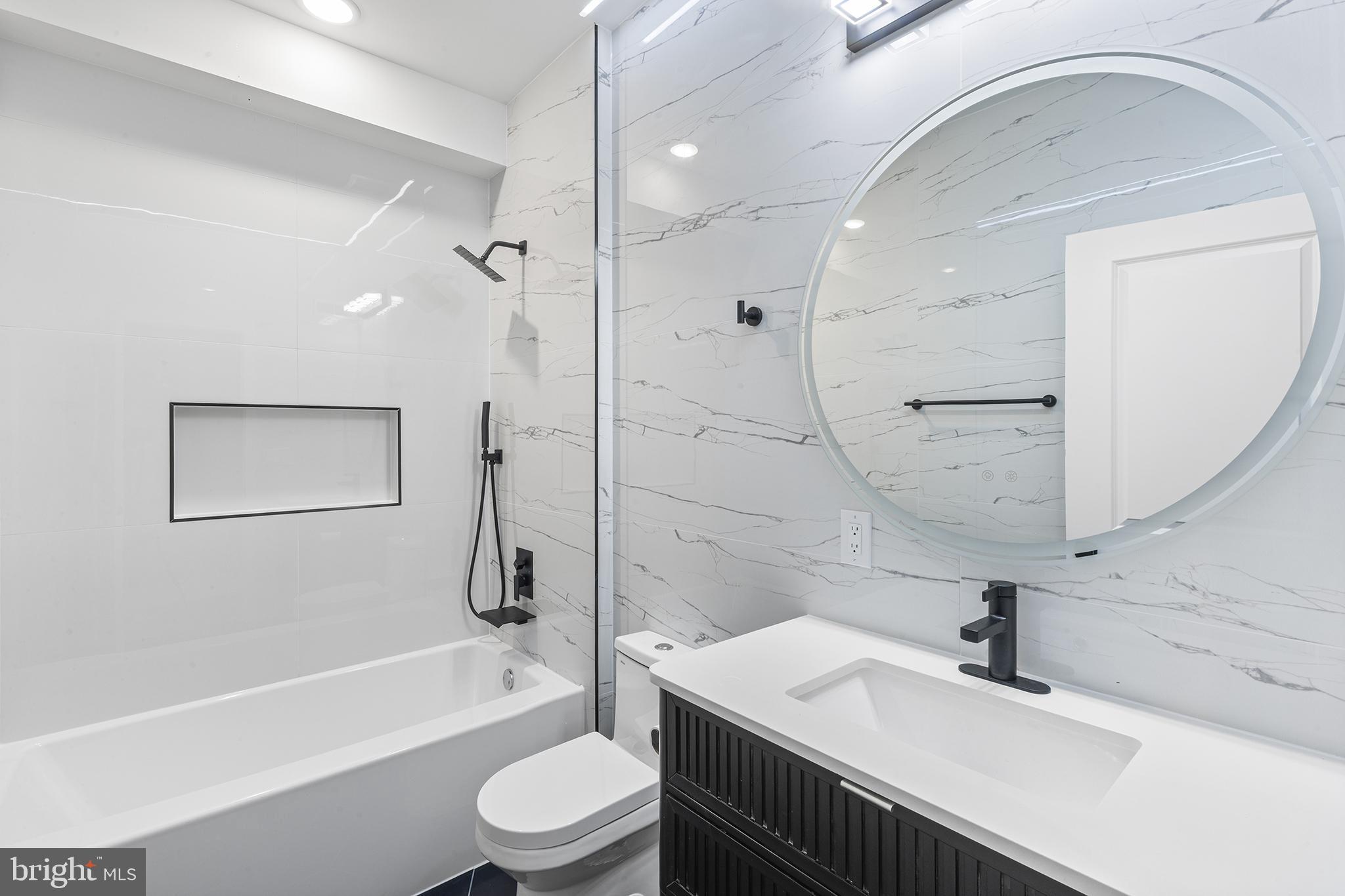 1413 North 8th Street Philadelphia, PA 19122 - Photo 31 of 44 a bathroom with a sink a toilet and a bathtub