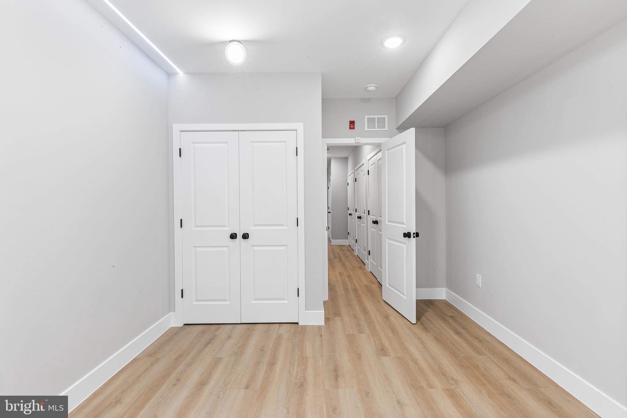 1413 North 8th Street Philadelphia, PA 19122 - Photo 36 of 44 a view of a hallway with wooden floor