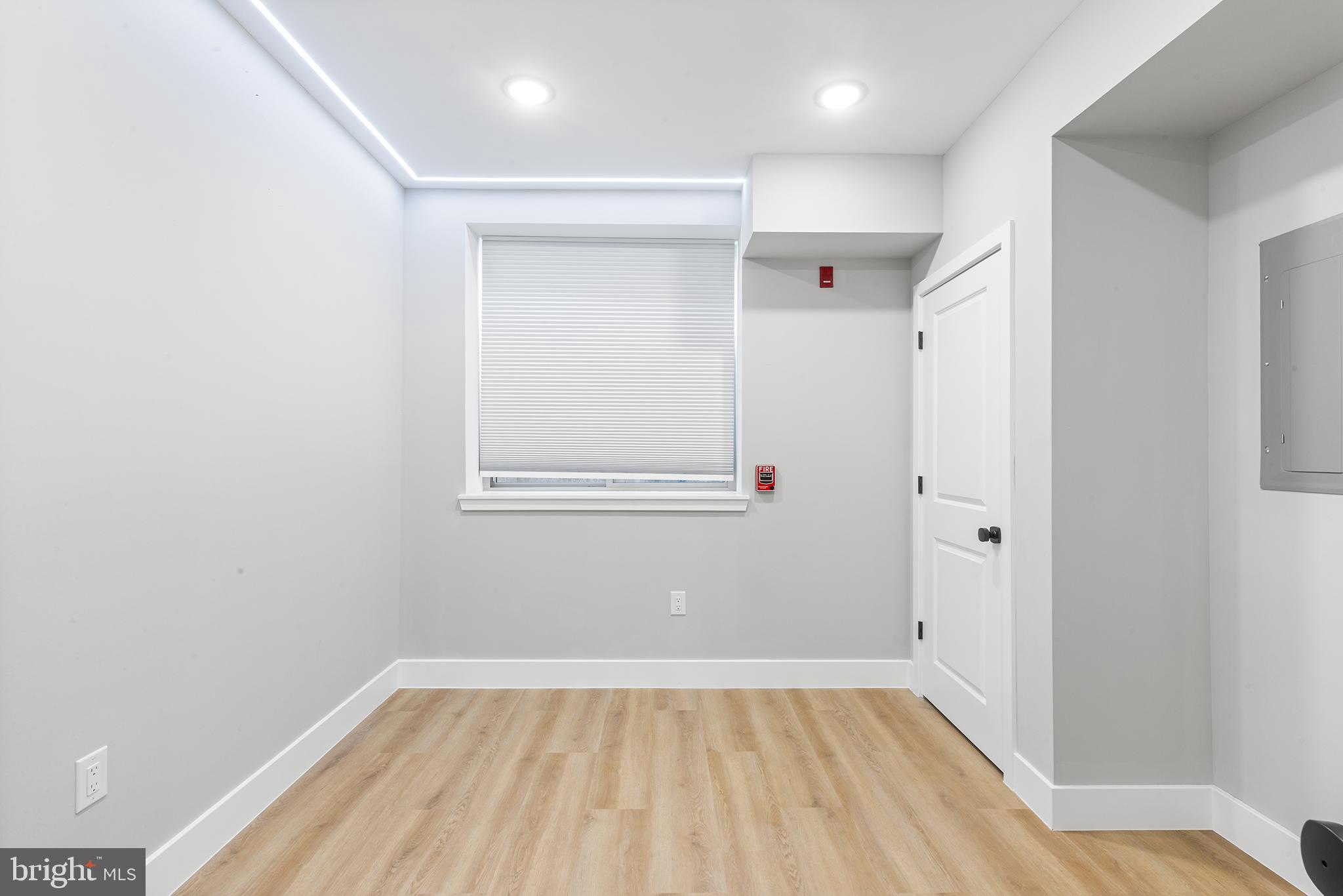 1413 North 8th Street Philadelphia, PA 19122 - Photo 37 of 44 a view of a room with wooden floor and white walls
